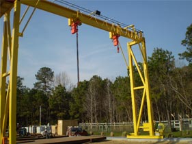 A 100 metric ton double girder bridge crane with a 25 ton auxiliary hoist